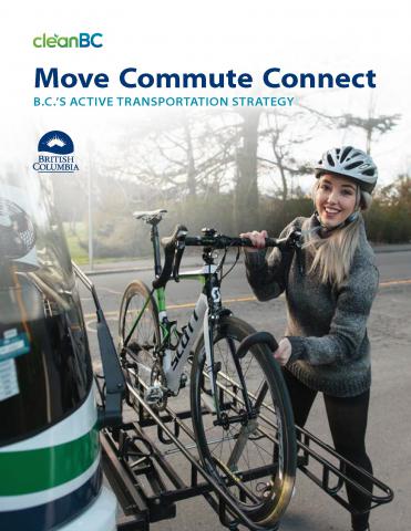 Woman placing bike on bus rack